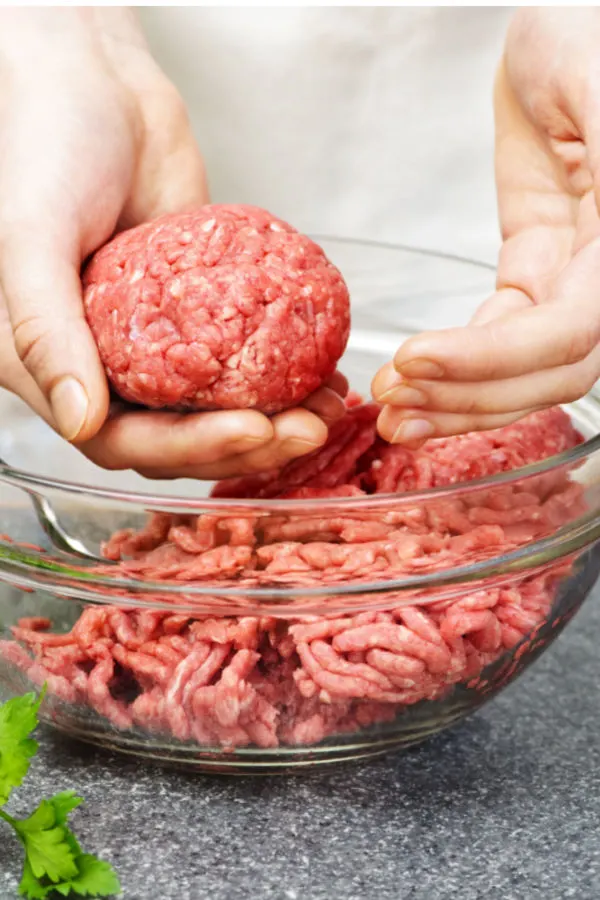 hands forming ground beef patties to make best homemade grilled hamburgers