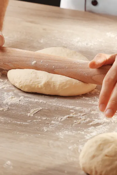 rolling pizza dough