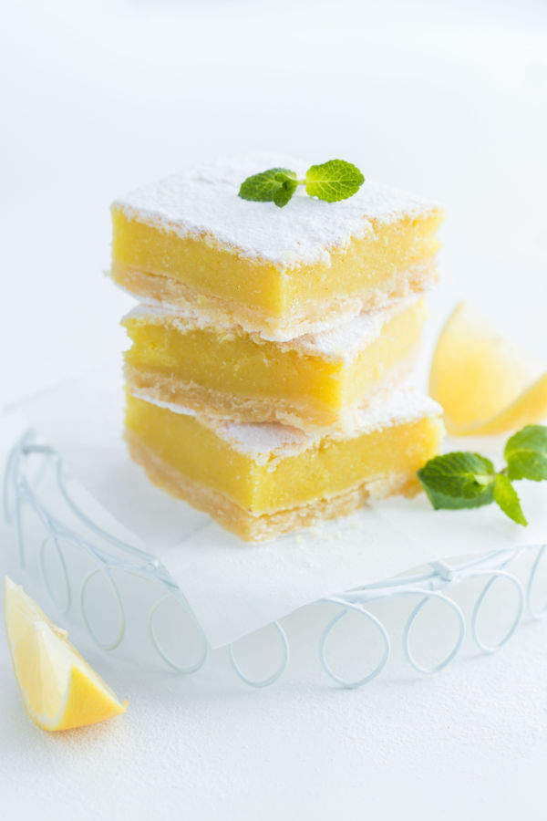 stack of lemon bars with powdered sugar