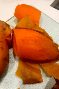 peeling sweet potatoes