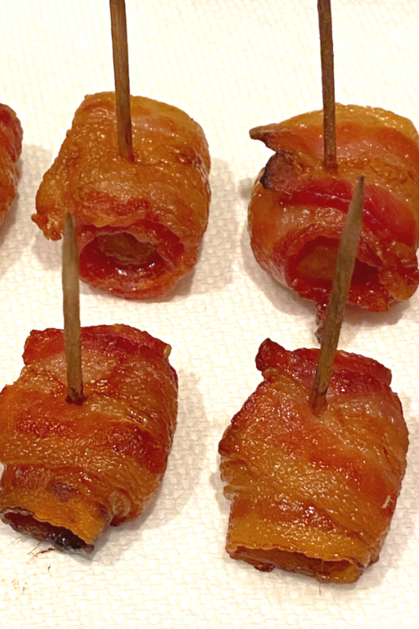 bacon wrapped appetizer on paper towel 