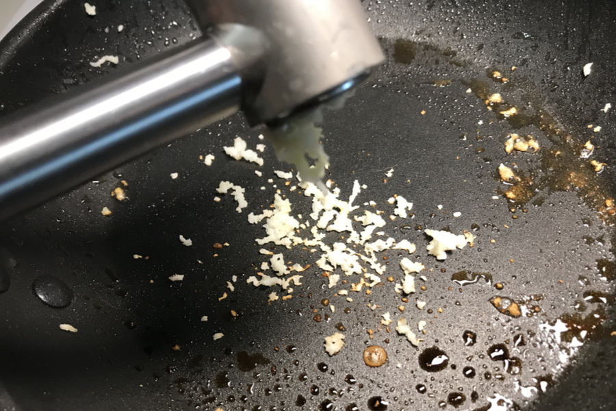 garlic press in pan 