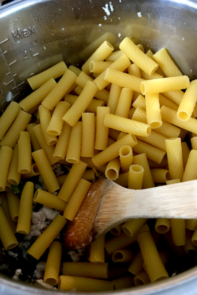 stirring rigatoni noodles 