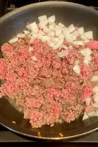 ground beef and onions in skillet
