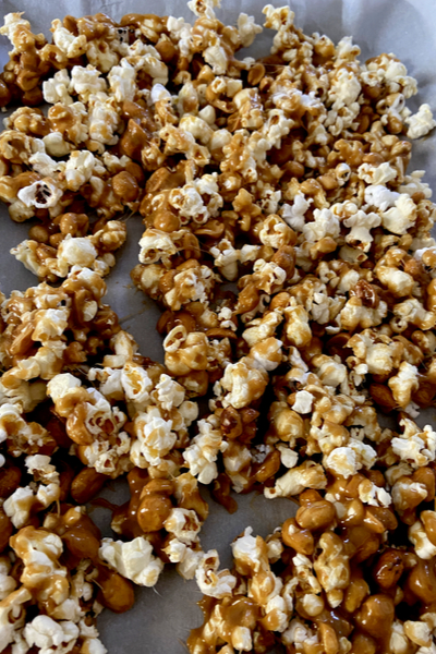 tossing caramel corn 