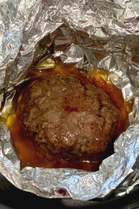 cooked hamburger in foil