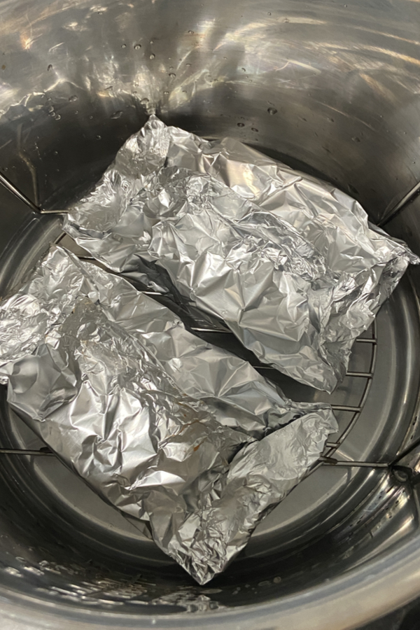 foil packets of burgers in a pressure cooker