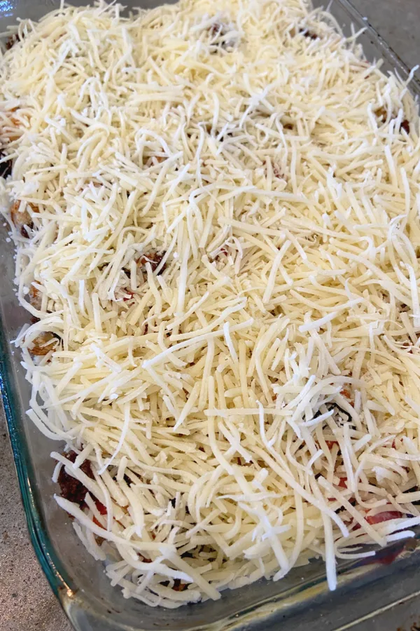 shredded Swiss cheese on top of Rueben casserole 