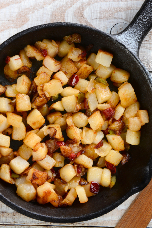 cubed potatoes in a skillet 