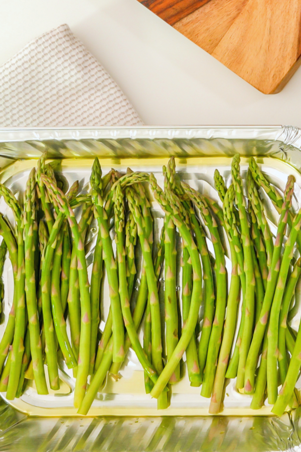 asparagus spears drizzled with oil before going in the air fryer
