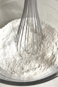 whisking flour