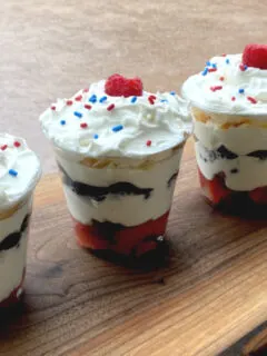 patriotic parfait cups on a wooden board