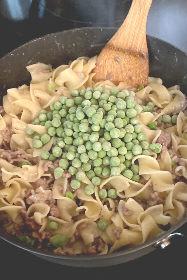frozen peas added to skillet