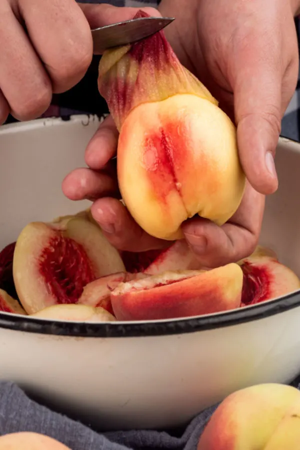 peeling the skin off fruit 