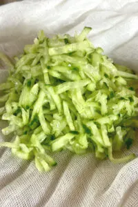 grated cucumber on cheesecloth