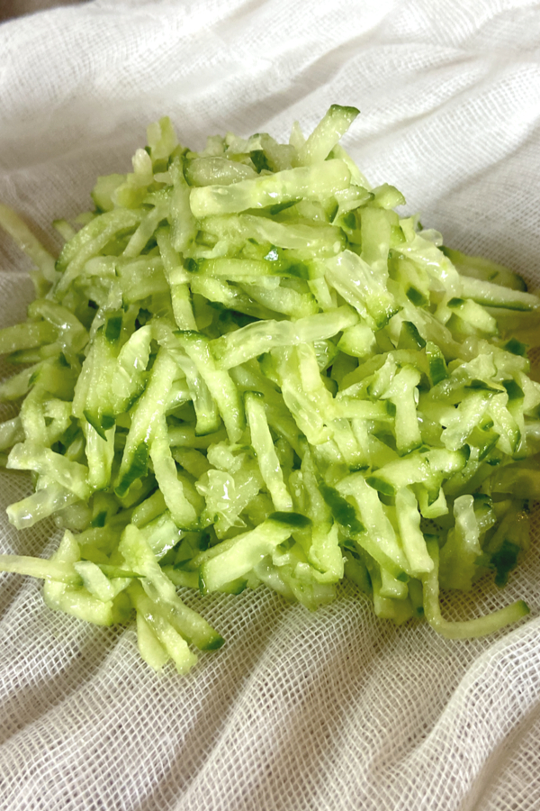 grated cucumber on cheesecloth