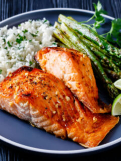 best air fryer salmon on plate with rice and asparagus