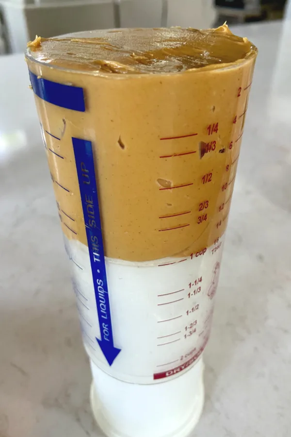 https://makeyourmeals.com/wp-content/uploads/2022/08/creamy-peanut-butter-in-measuring-cup.jpg.webp