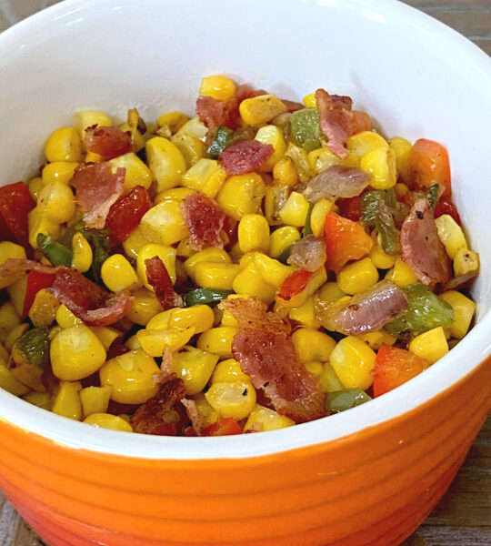 skillet corn in orange ramekin