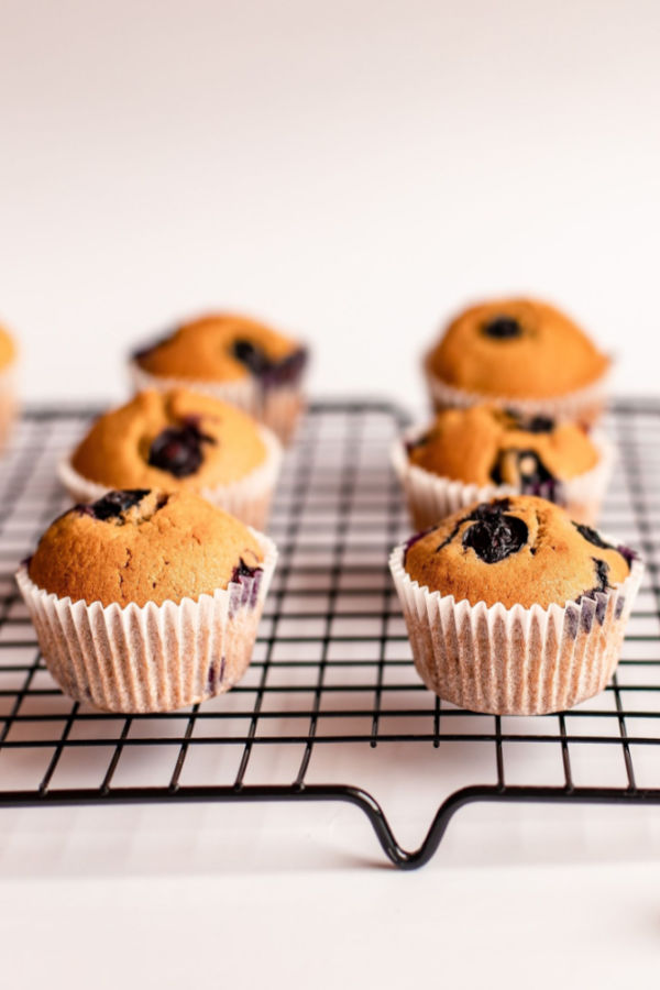 mini blueberry muffins on a cooling rack