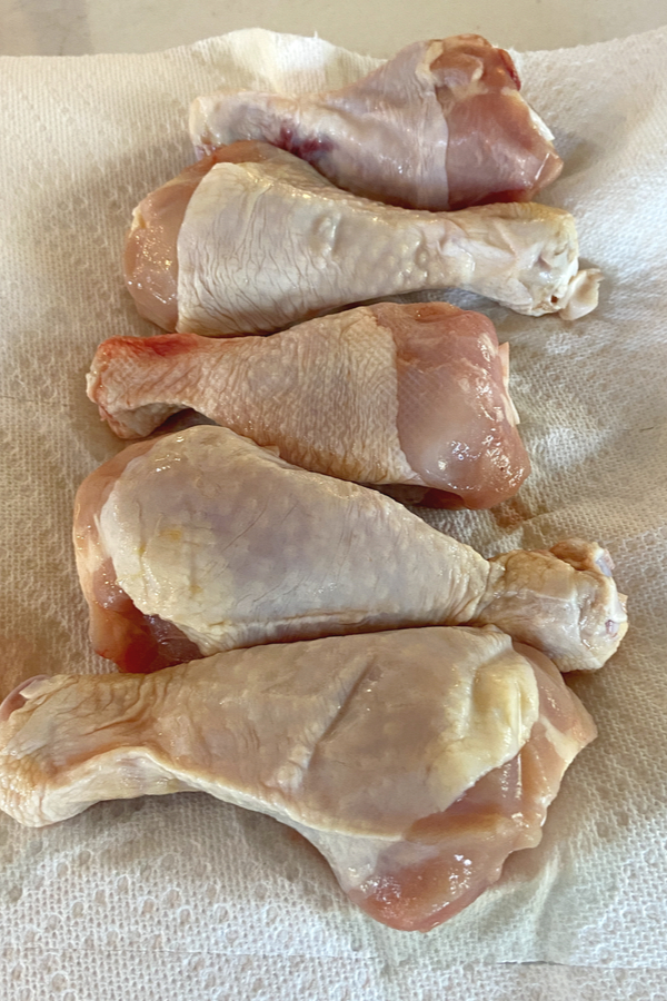 chicken legs on paper towel 