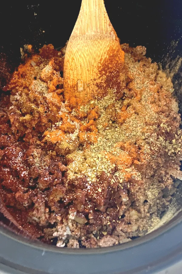 ground beef and chili seasonings in crock pot 