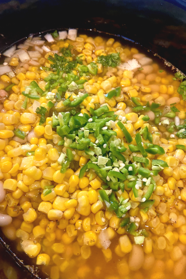 corn and diced jalapeno in pot