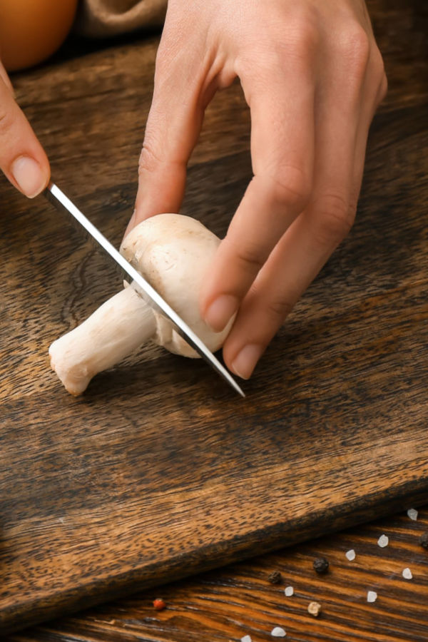 cutting the stem of mushroom