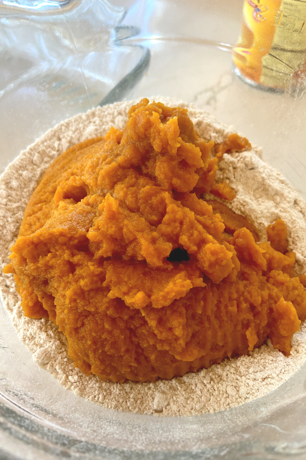 pumpkin puree in bowl with cake mix 