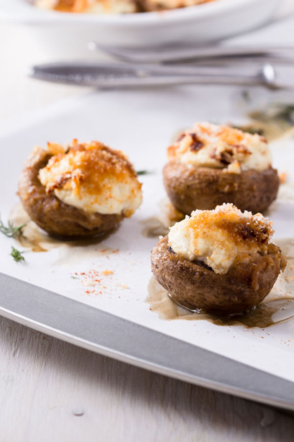 stuffed mushrooms on baking sheet 