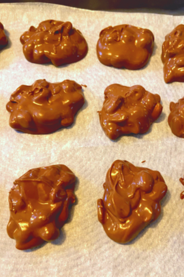 mounds of triple nut clusters on wax paper 