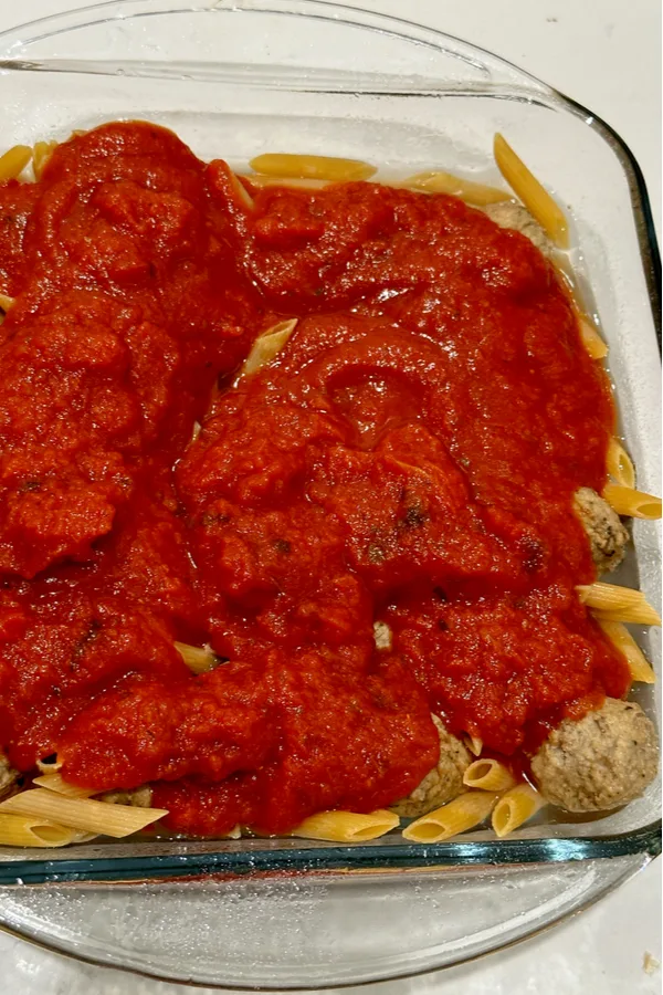marinara sauce on meatballs and pasta 