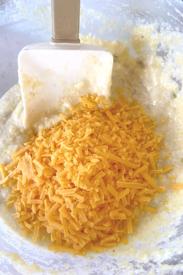 cream cheese and shredded cheddar cheese in bowl