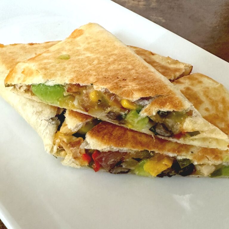 loaded chicken quesadilla on platter