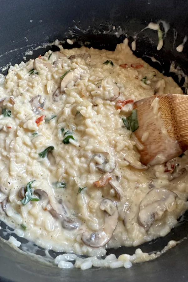 mushroom and spinach risotto in pot
