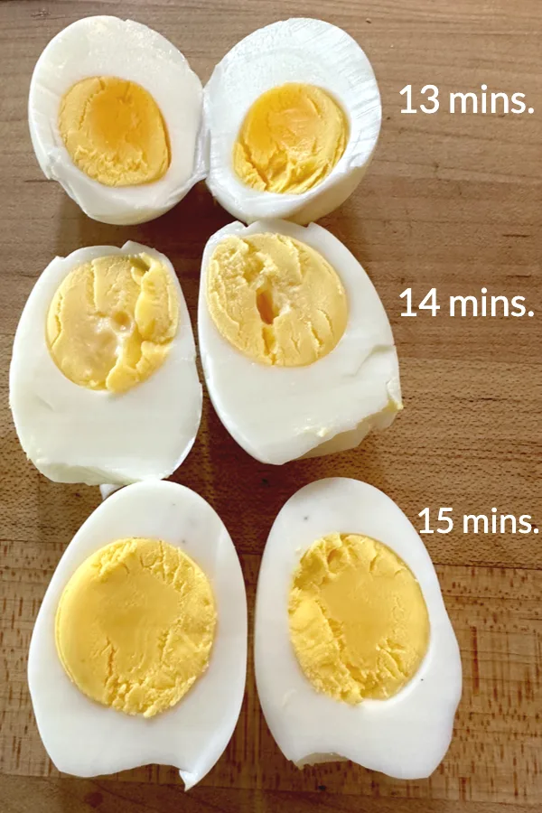 eggs split in half showing the doneness of the yolks when making air fryer hard boiled eggs