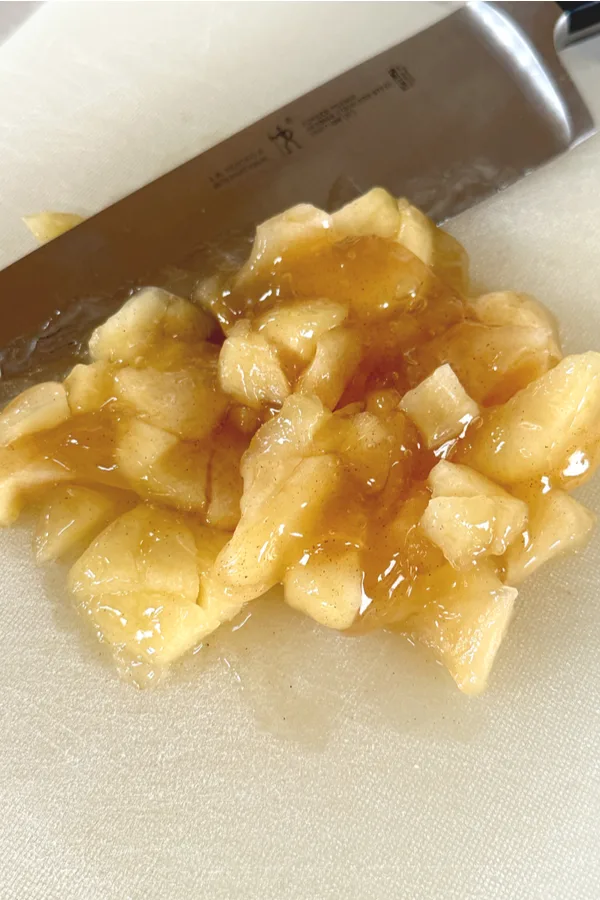 cutting apple pie filling with a knife