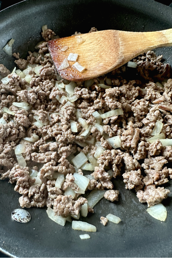 ground beef and onions in skillet 