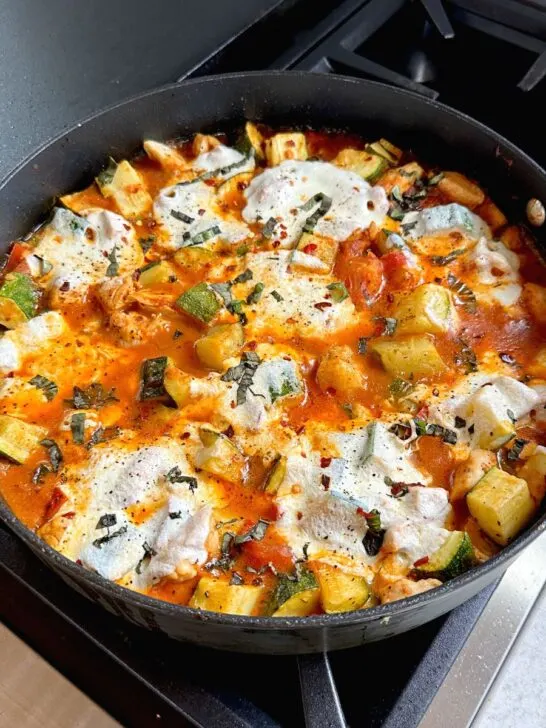 caprese chicken and zucchini in a skillet