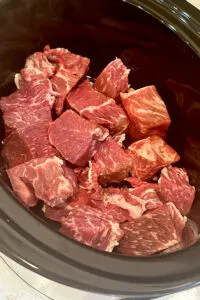 chuck roast cubed in crock pot