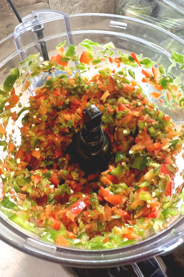 red and green peppers in food processor