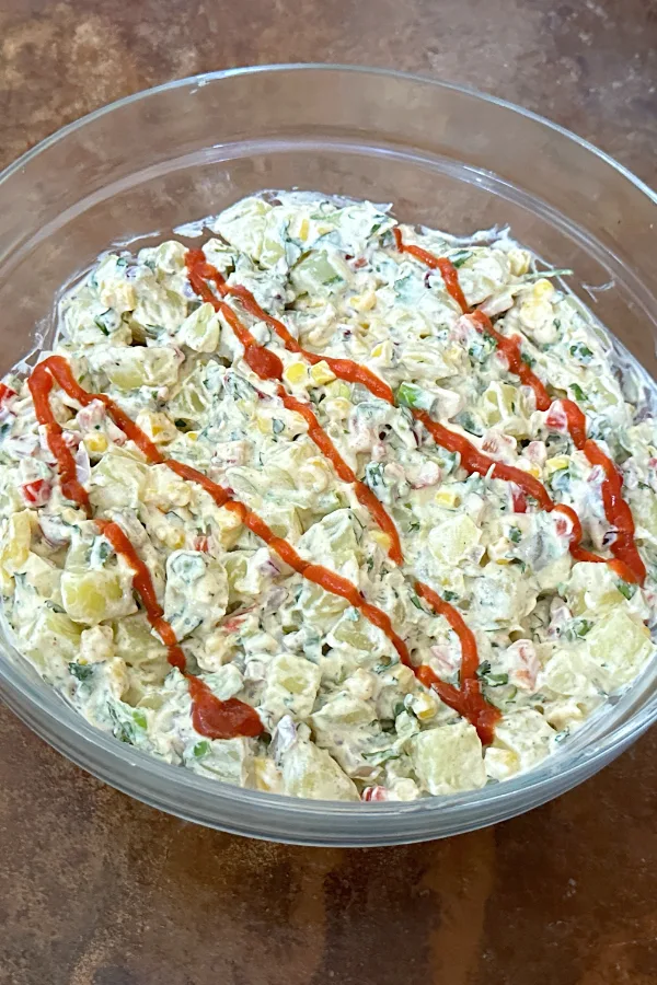 southwestern potato salad with Sriracha sauce on top