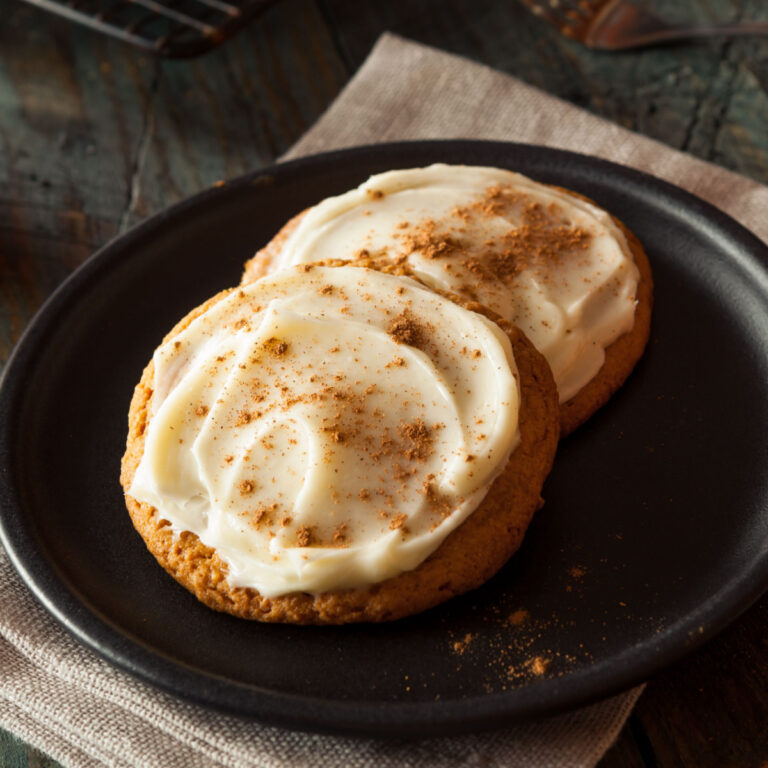 2 pumpkin cookies with cream cheese frosting