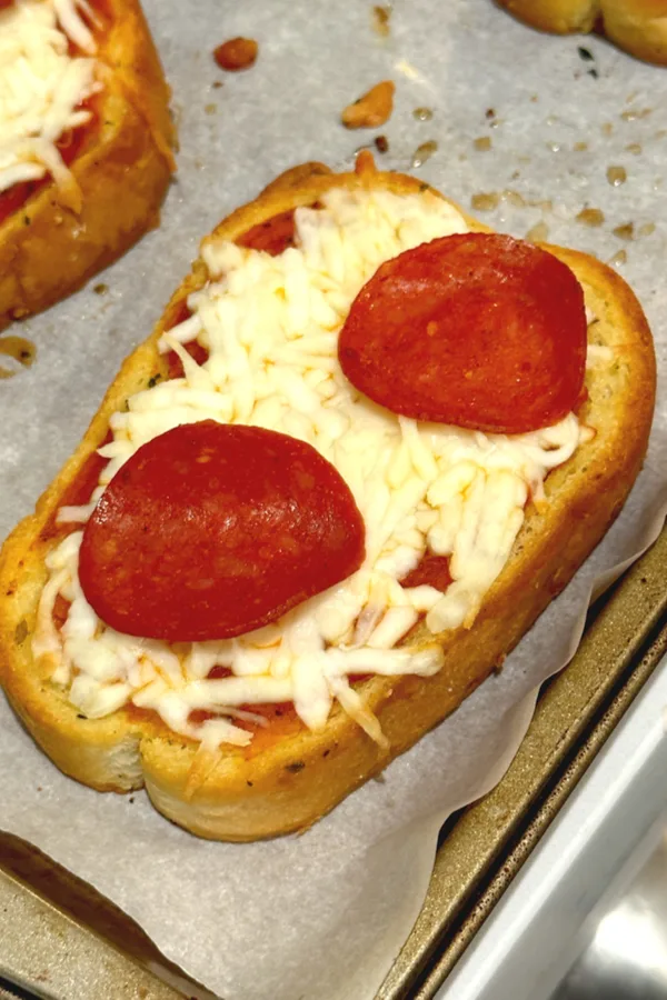 pepperoni and cheese melted on garlic toast