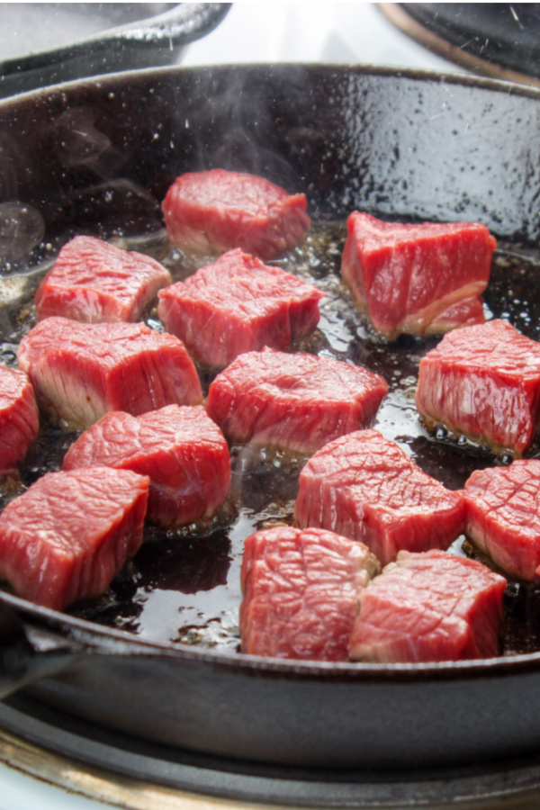 searing stew meat in skillet