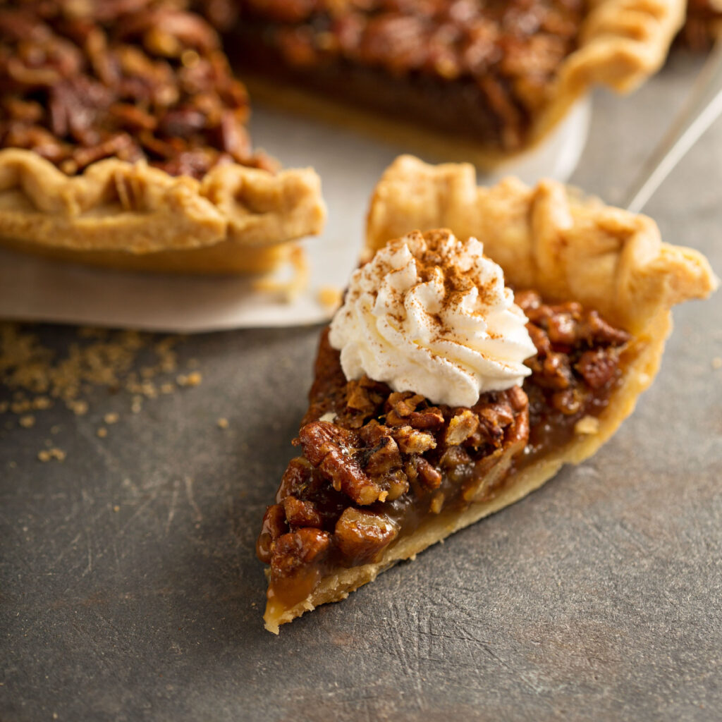 easy pecan pie recipe with a slice of pie with whipped topping