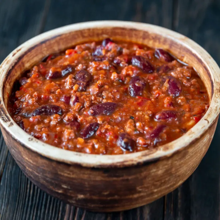 stove top chili in a wooden bowl