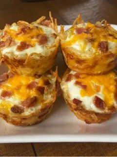 hash brown egg nests on white plate