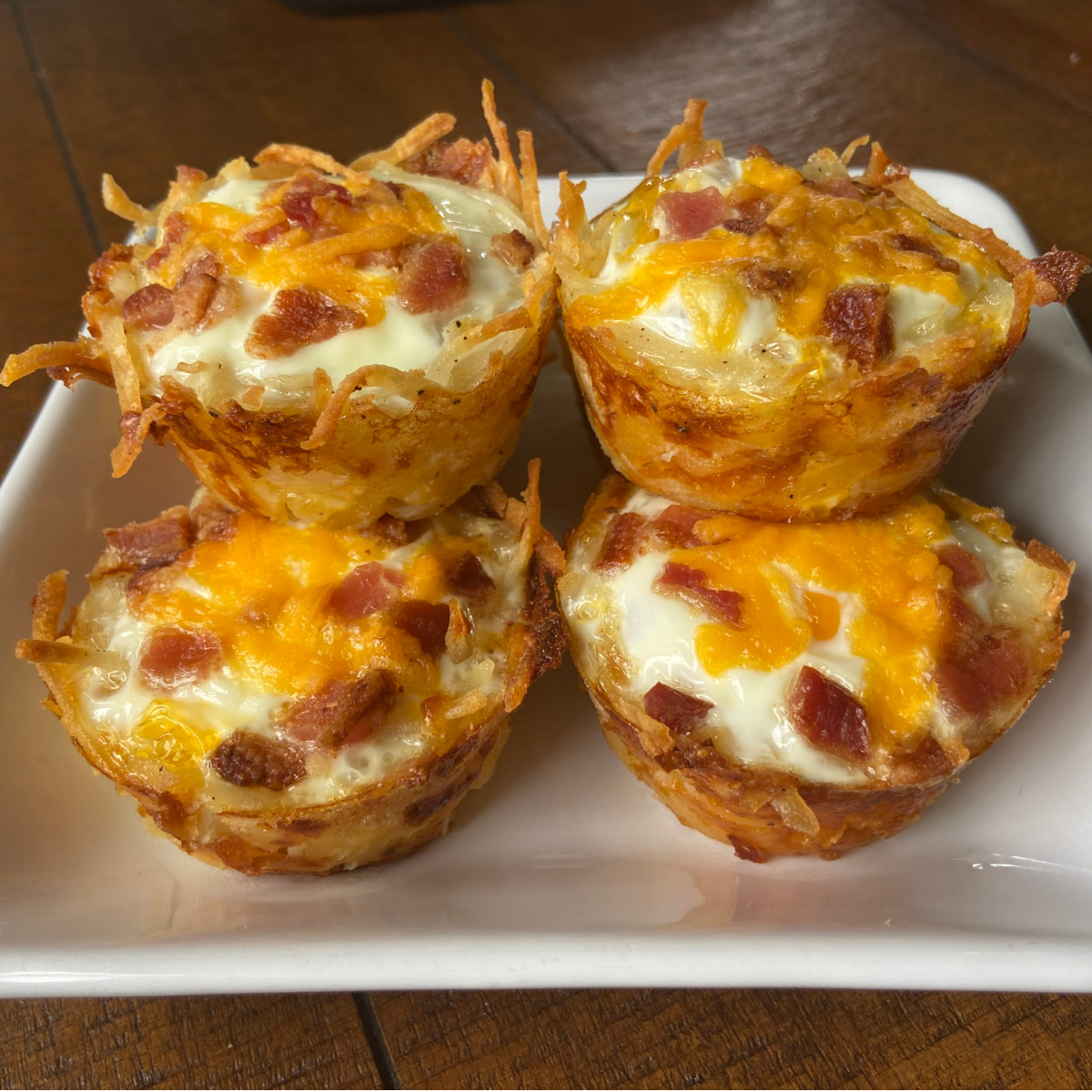 hash brown egg nests on white plate