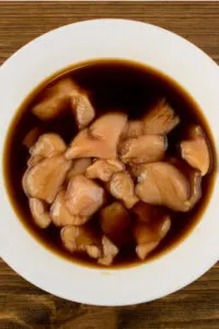 chicken marinating in soy sauce